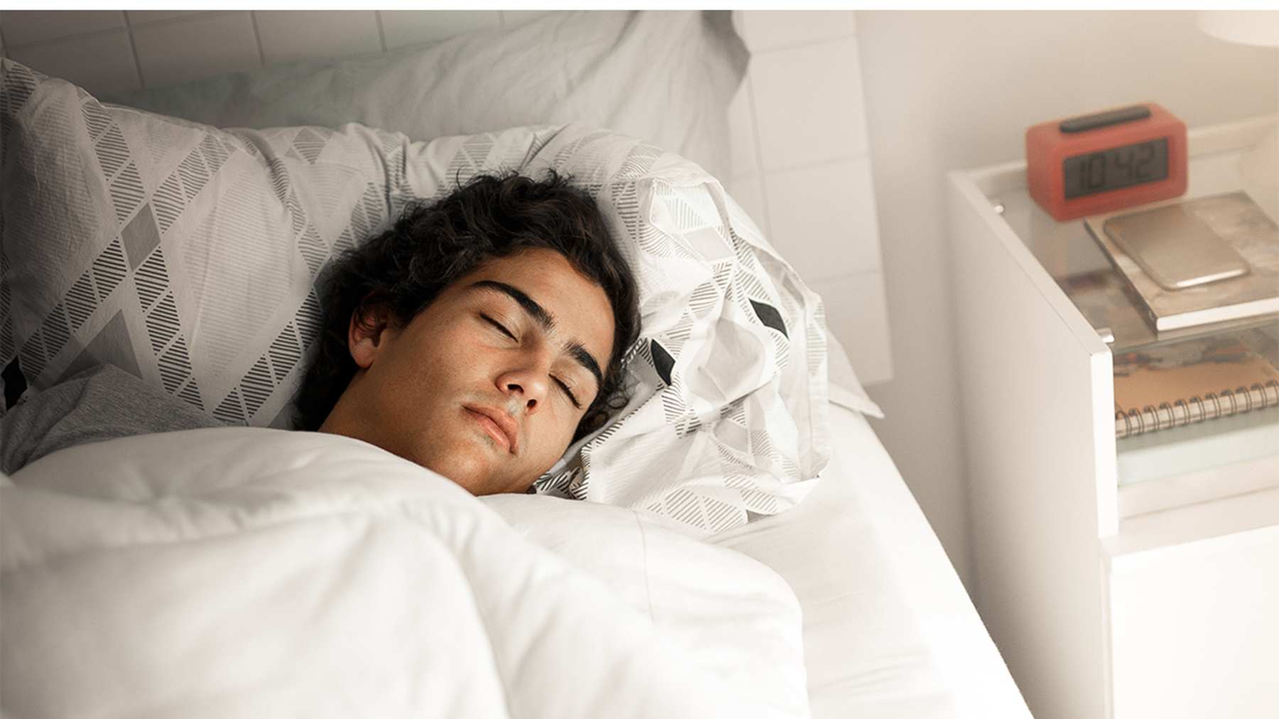 teenager asleep in bed