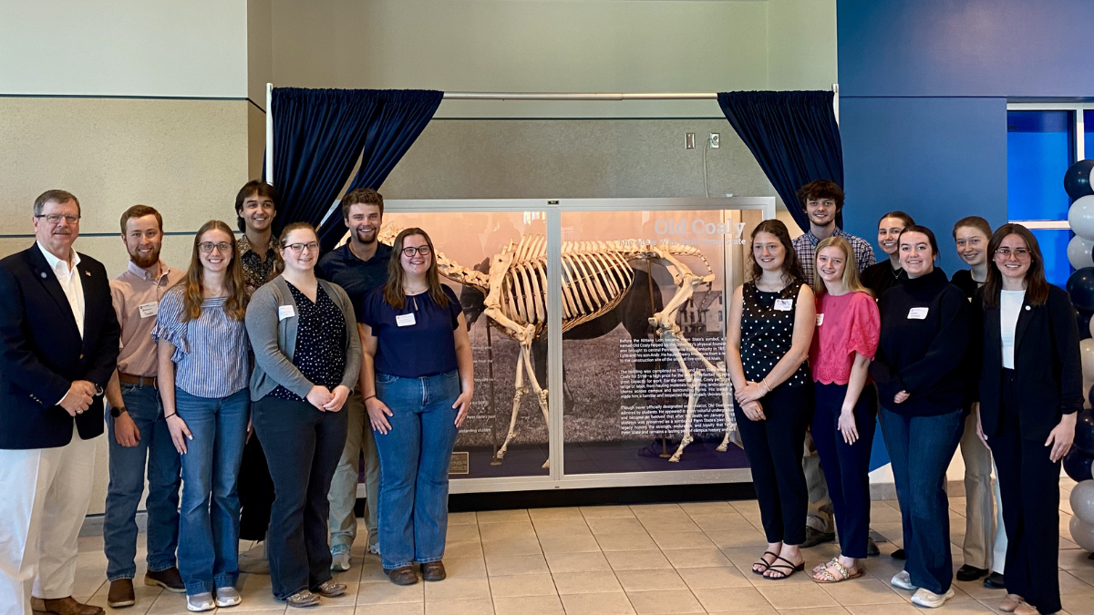 Attendees gathered around the display of Old Coaly's skeleton