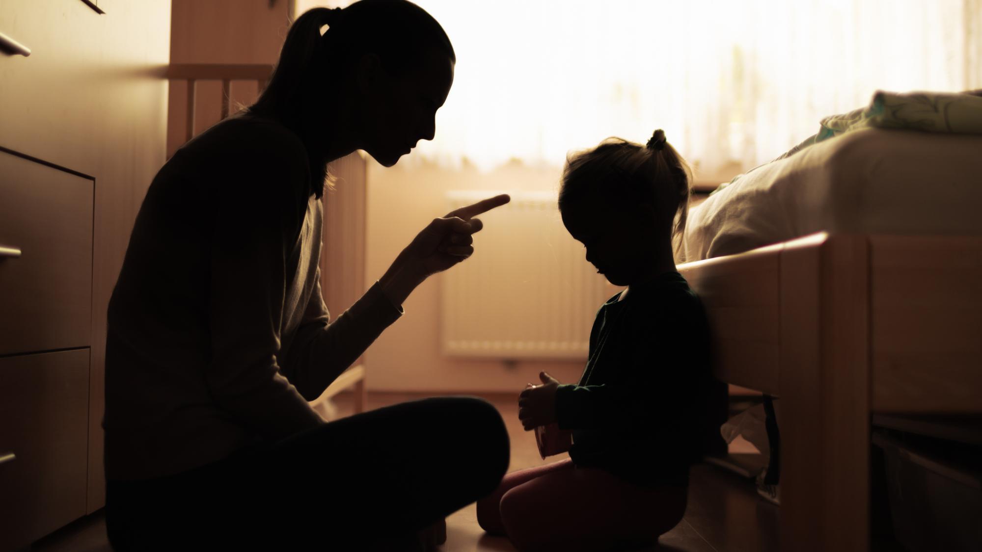 Mother lectures preschooler.