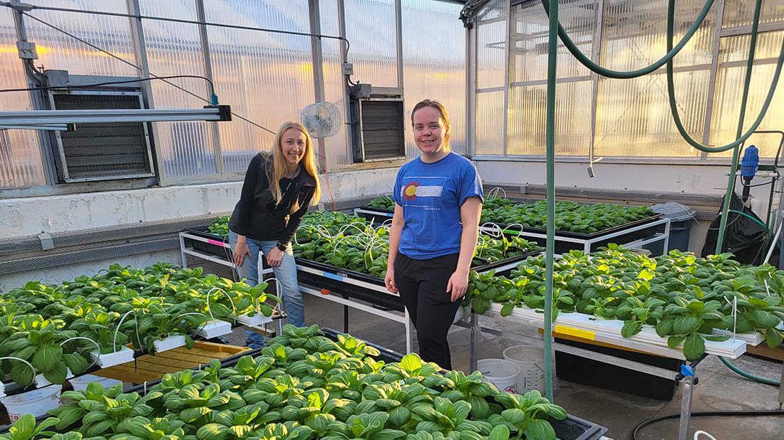 2 researchers with plants