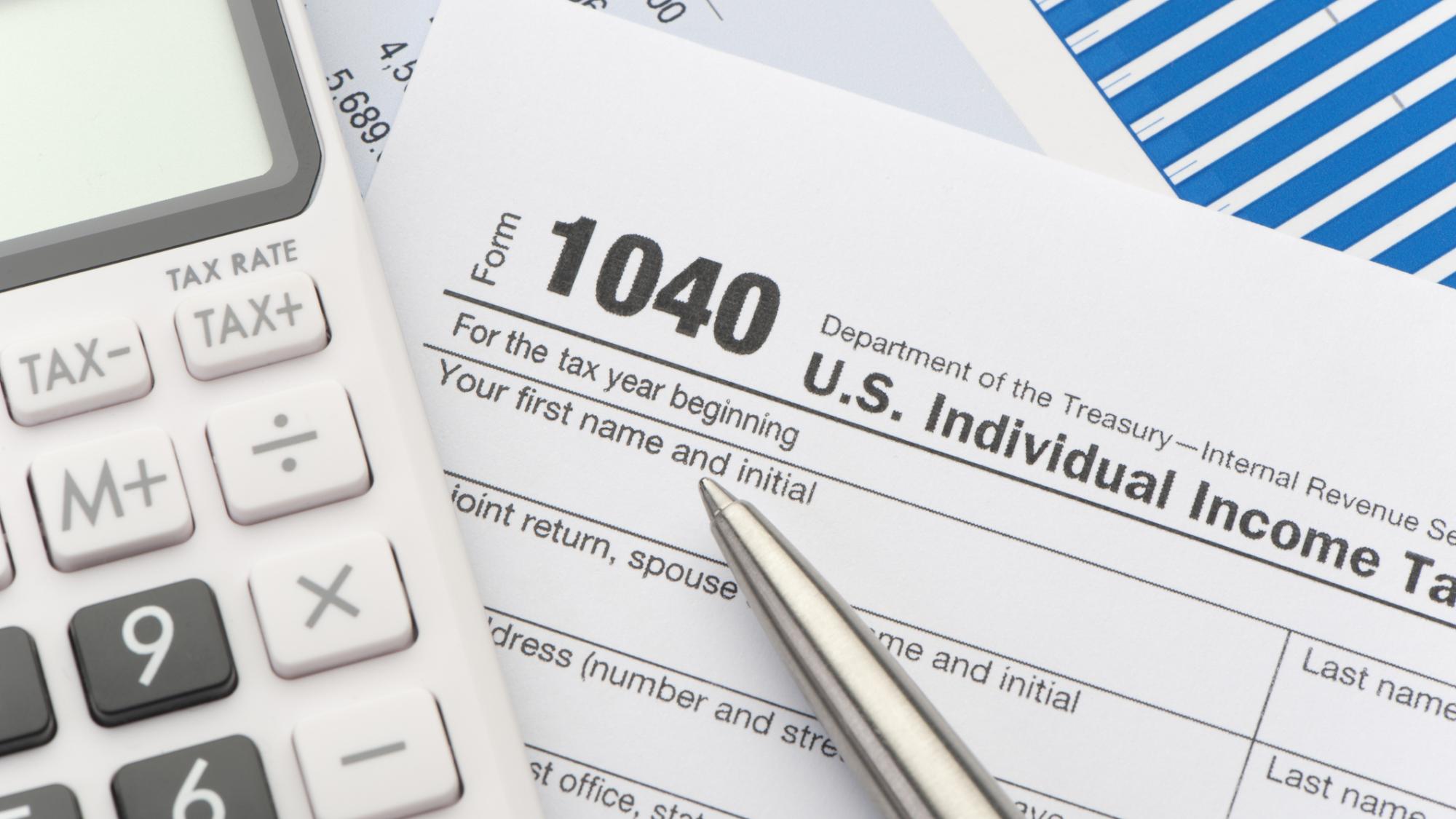 Calculator and 1040 tax form
