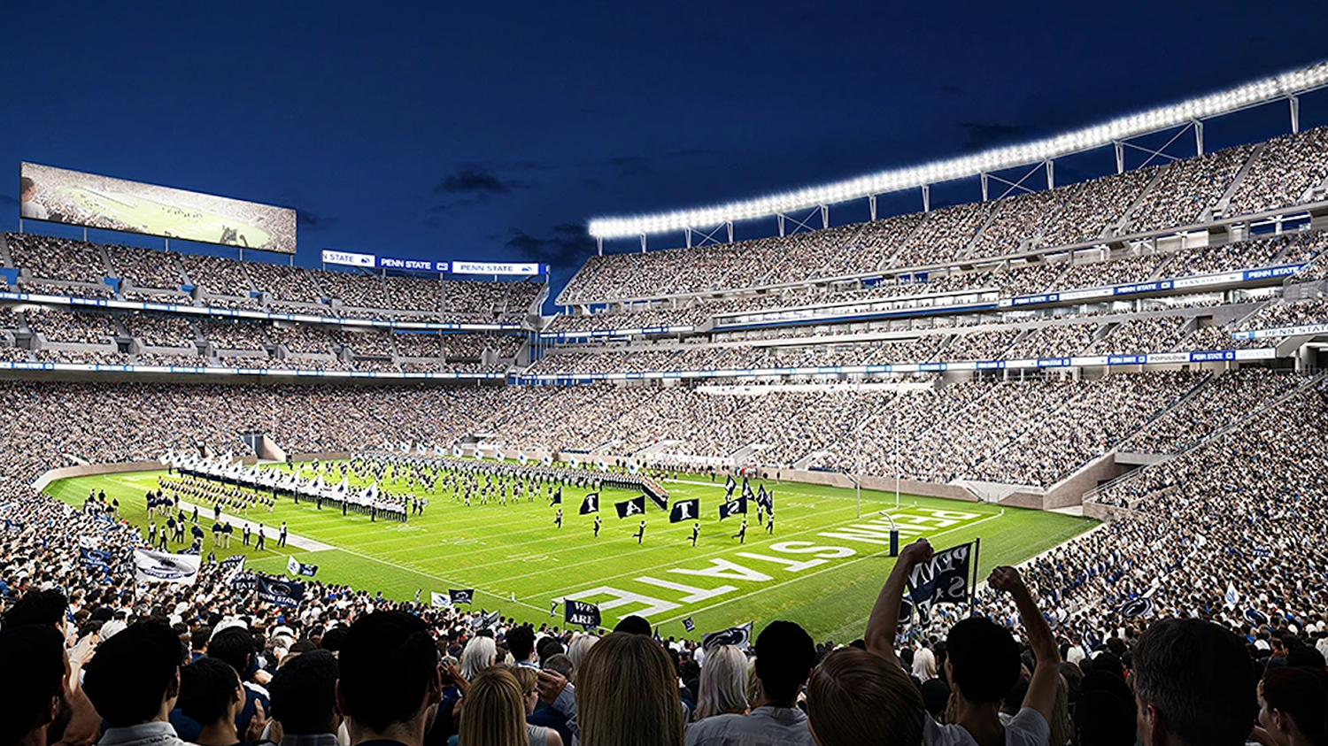 A full stadium watches a half-time show at a football game