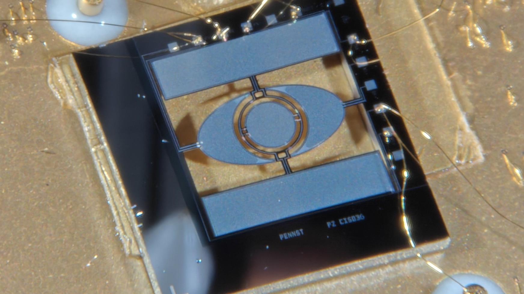 A tiny mirror mounted on a gold background
