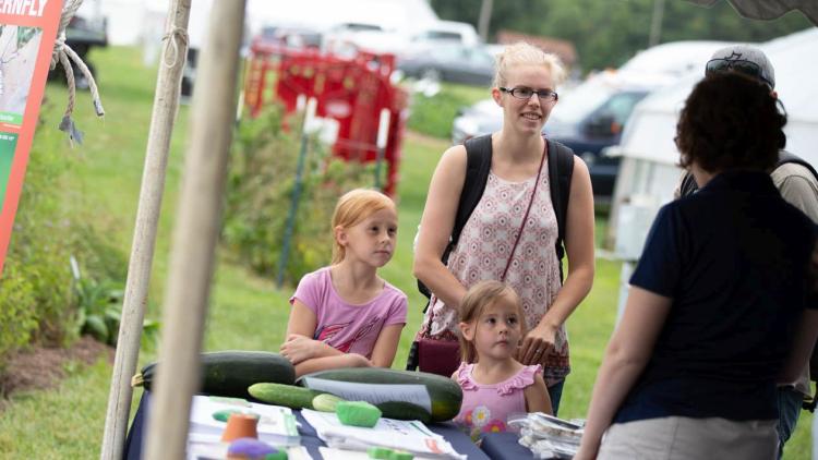 master gardener answers family's questions at Ag Progress Days