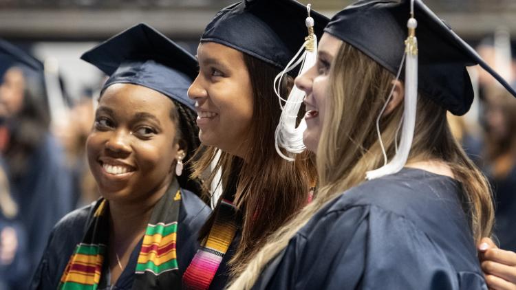 graduates sing alma mater