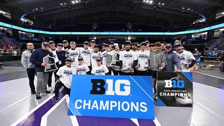 Team poses with championship banner