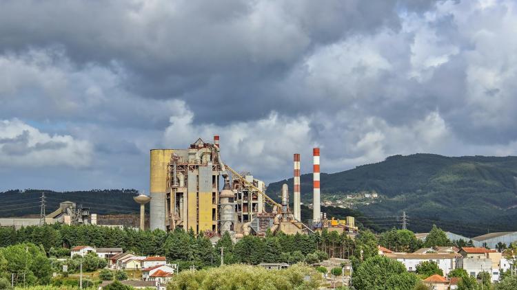 Factory situated in a rural landscape.