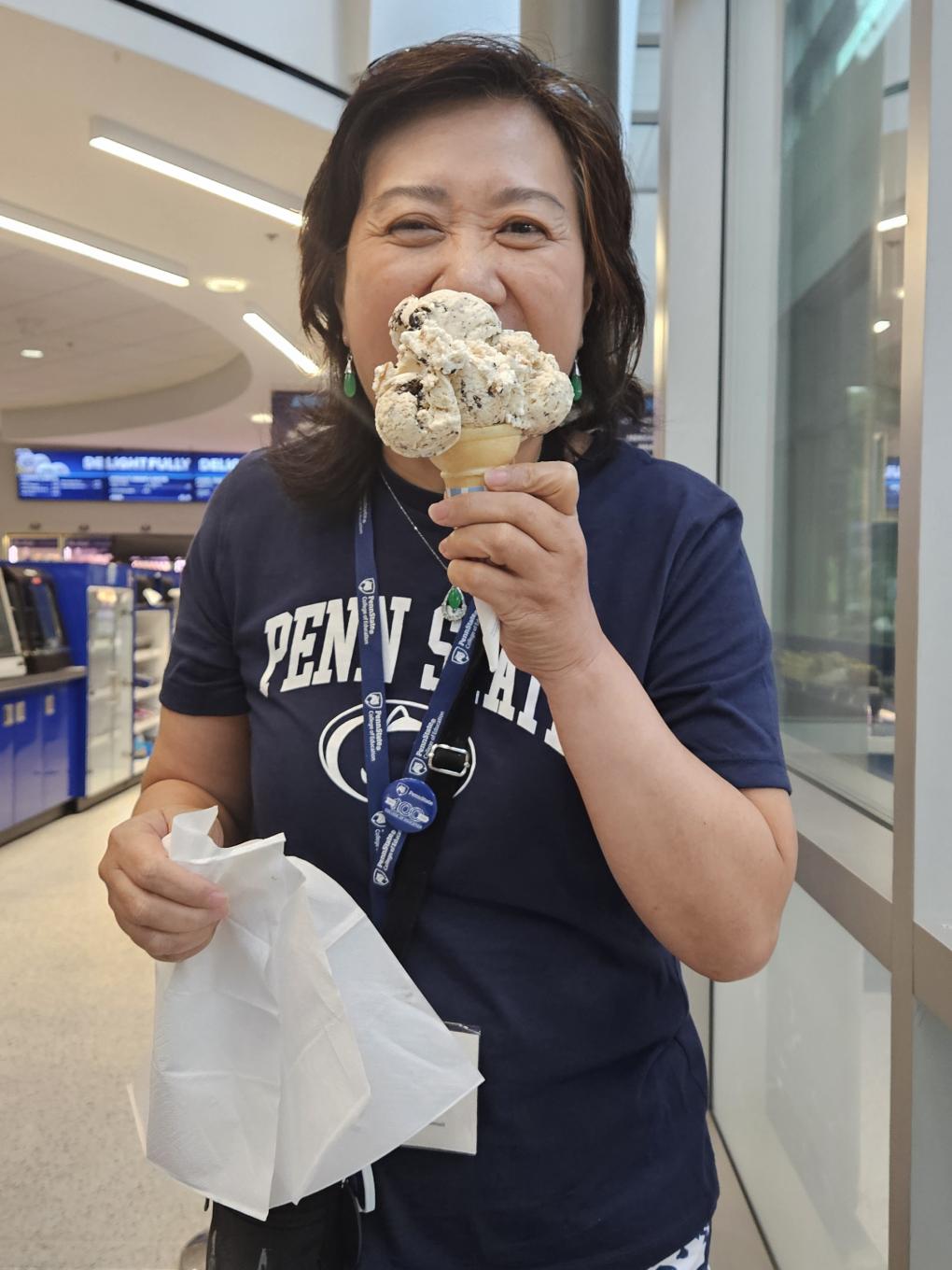 A student enjoys an ice cream cone at the Berkey Creamery.