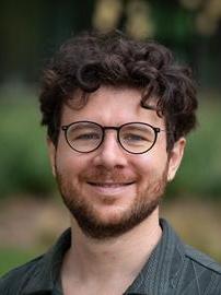 Enrico Casella, assistant professor of data science for animal systems in the College of Agricultural Sciences and a co-hire for the Institute for Computational and Data Sciences (ICDS) smiles for a photo.