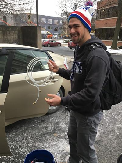 A Penn State student prepares to take samples of greenhouse gas levels around State College. 