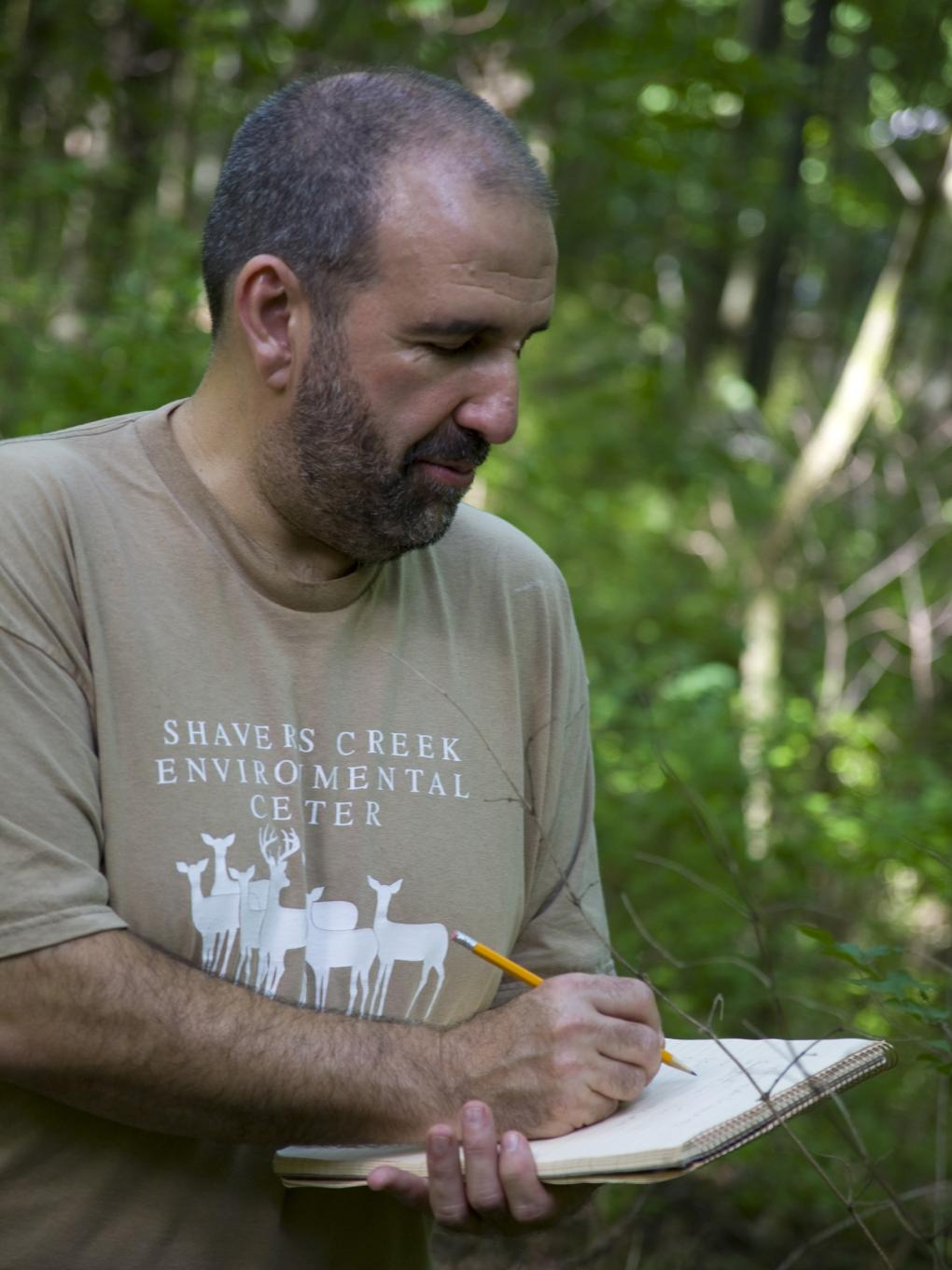 Associate Professor of Biology and Forestry Robert Loeb conducting fieldwork. 