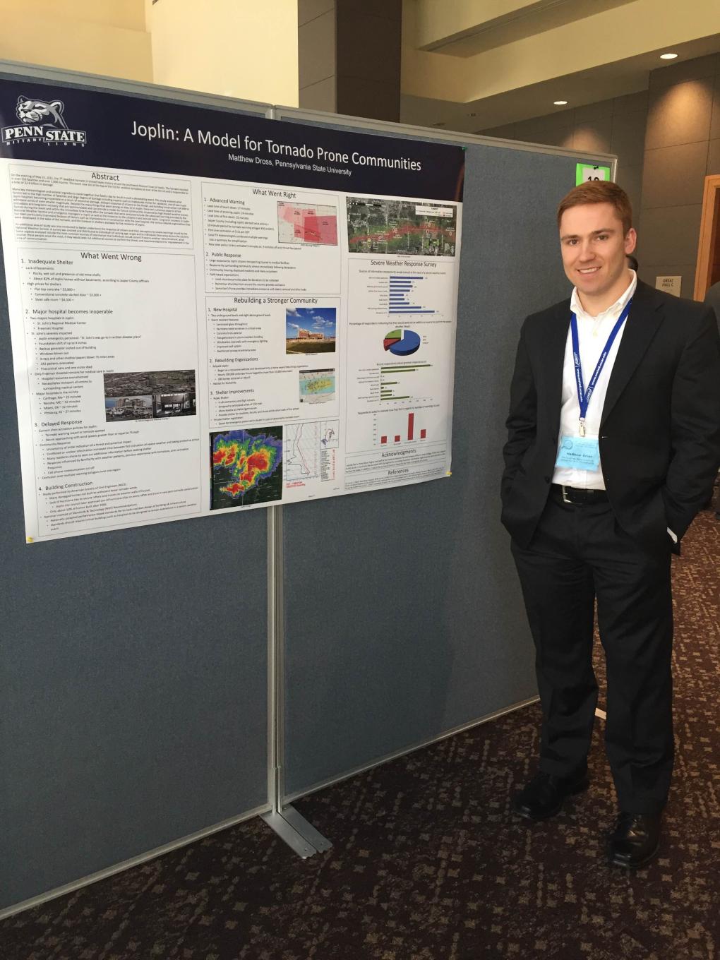 student presents poster at conference