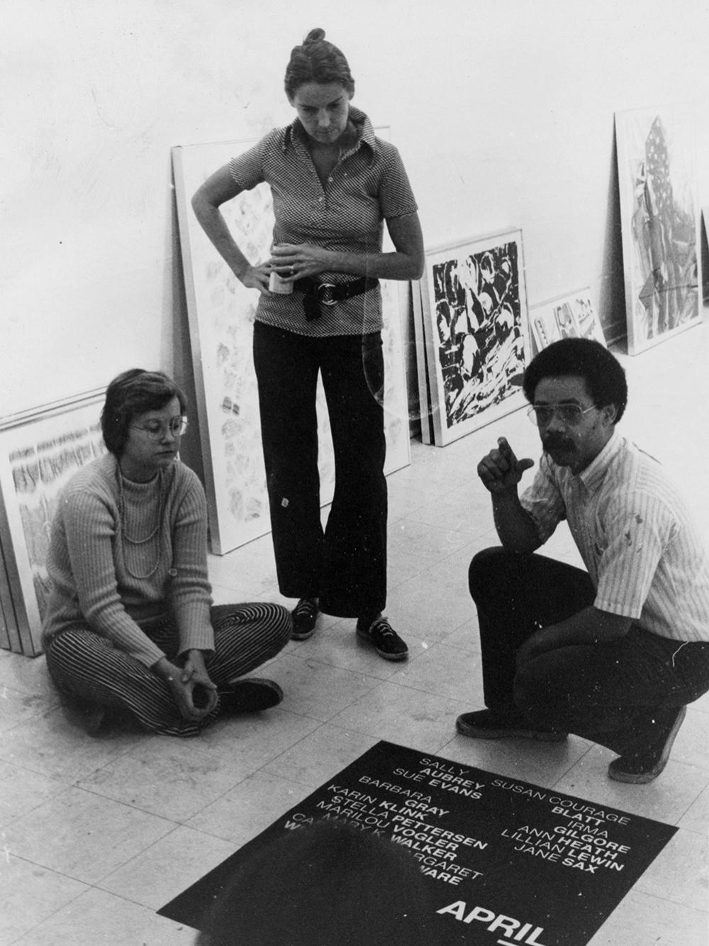 Robert Reed with two students at Yale preparing for an exhibit