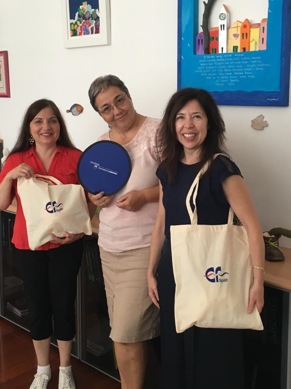 Two Berks Professors exchange gifts with the dean of the faculty of economics at the University of Split 