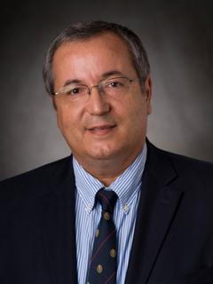 Photo of man in black suit jacket