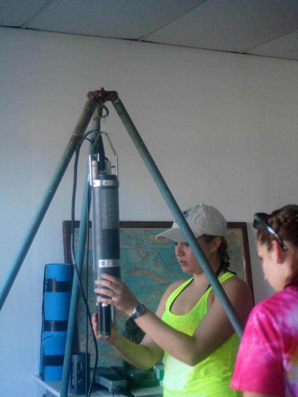 Penn State students Amy Yarnall and Liz Andrews calibrate a Sonde before collecting data in the field. The Sonde is used to measure water quality, including temperature, salinity and oxygen levels.