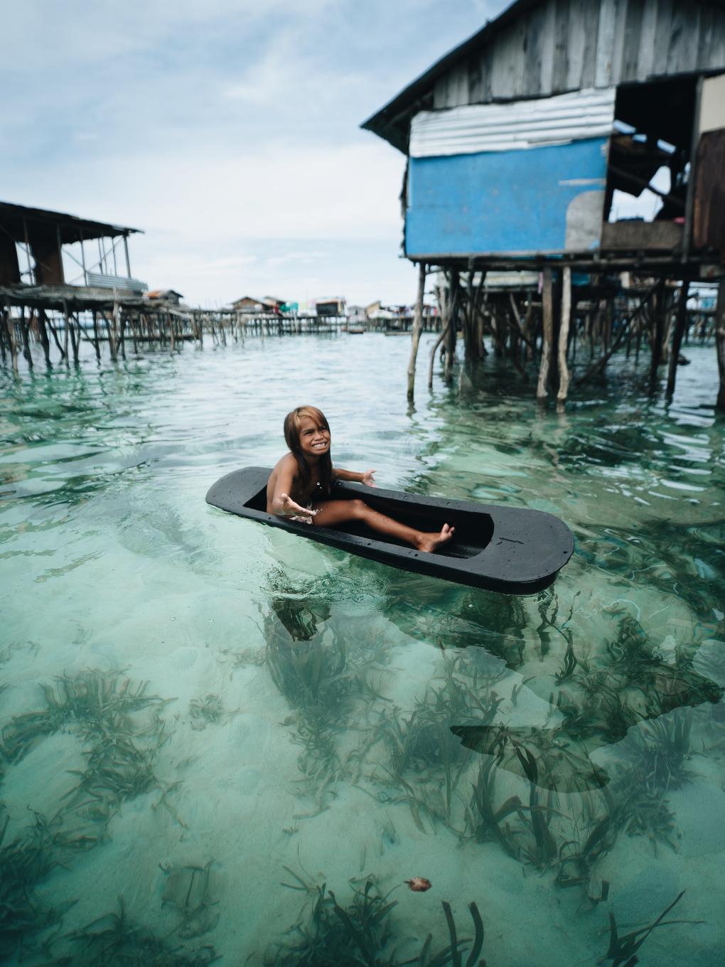 Bajau child in small boat
