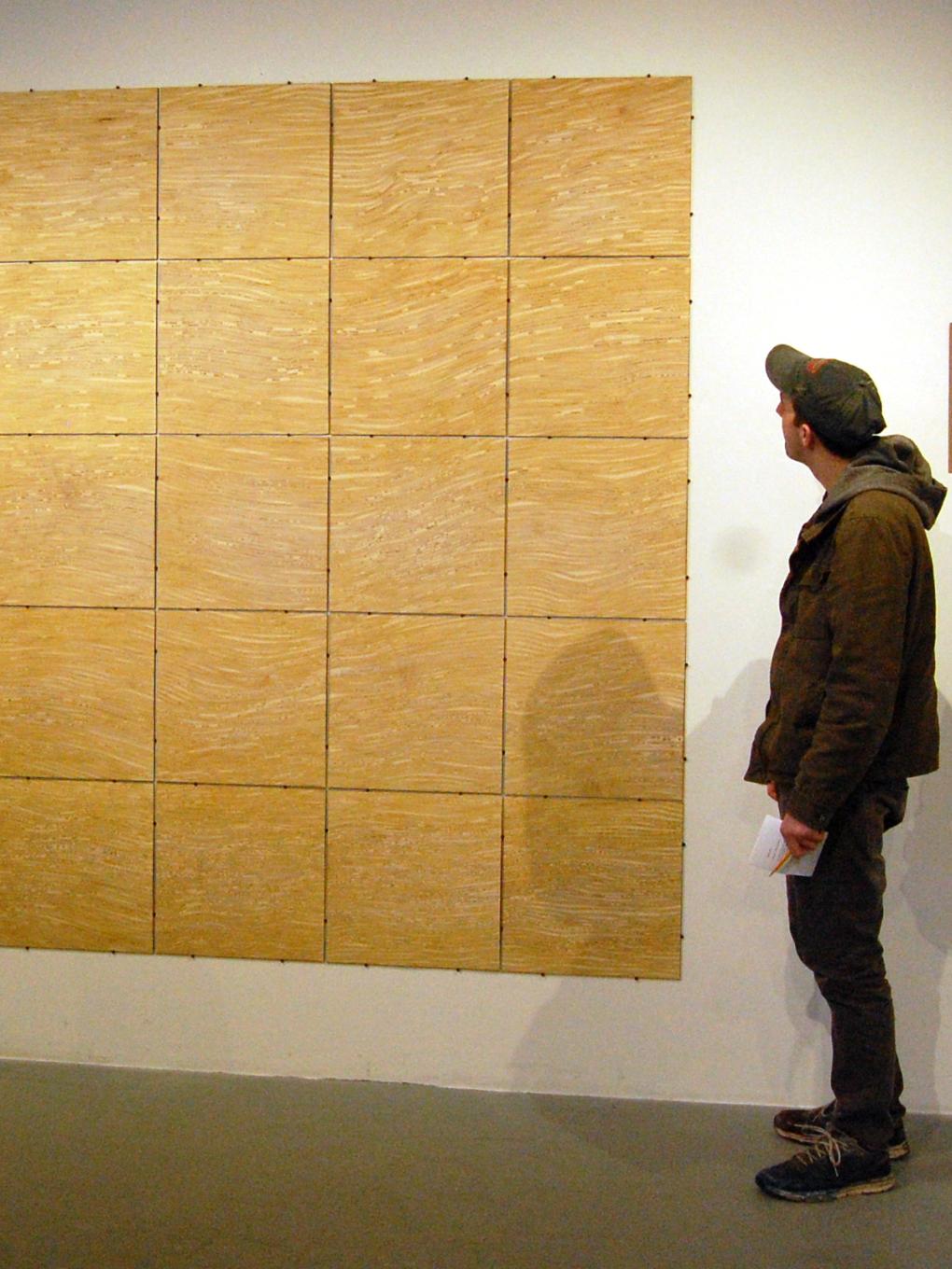 A man looks at artwork