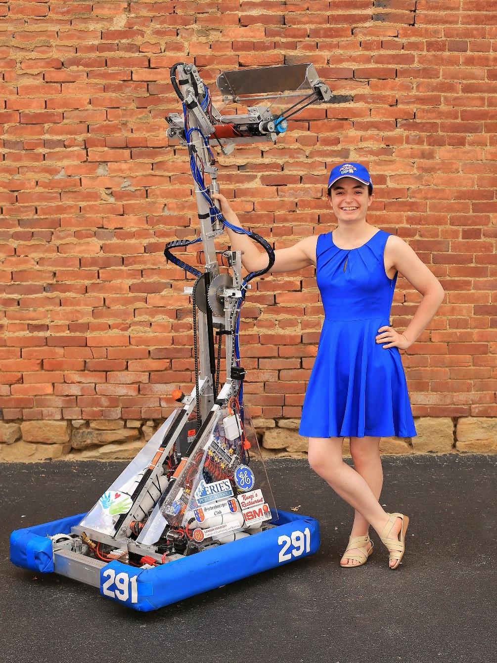 Penn State Behrend senior Julia Cecchetti stands next to a robotics project.