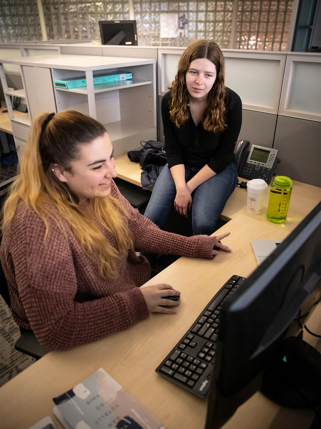 Katie Sarmiento and Kat Shatinsky are the first interns in a program intended to help software engineering students develop their skills. 