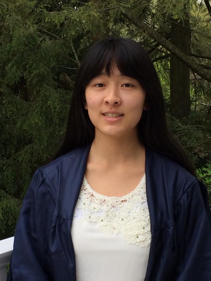 Miranda Chen posing for photograph in graduation gown