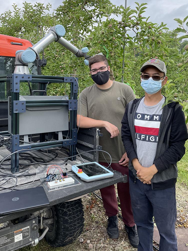researchers pose with gizmo