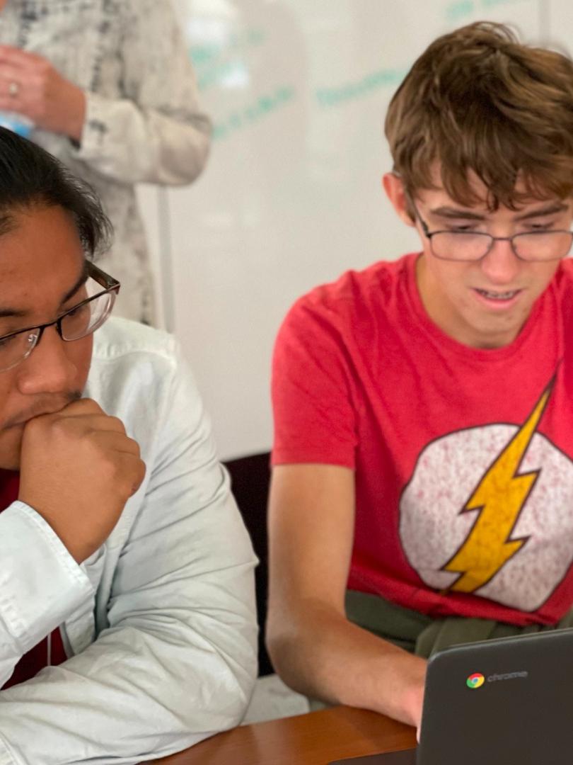 Students working on a computer.