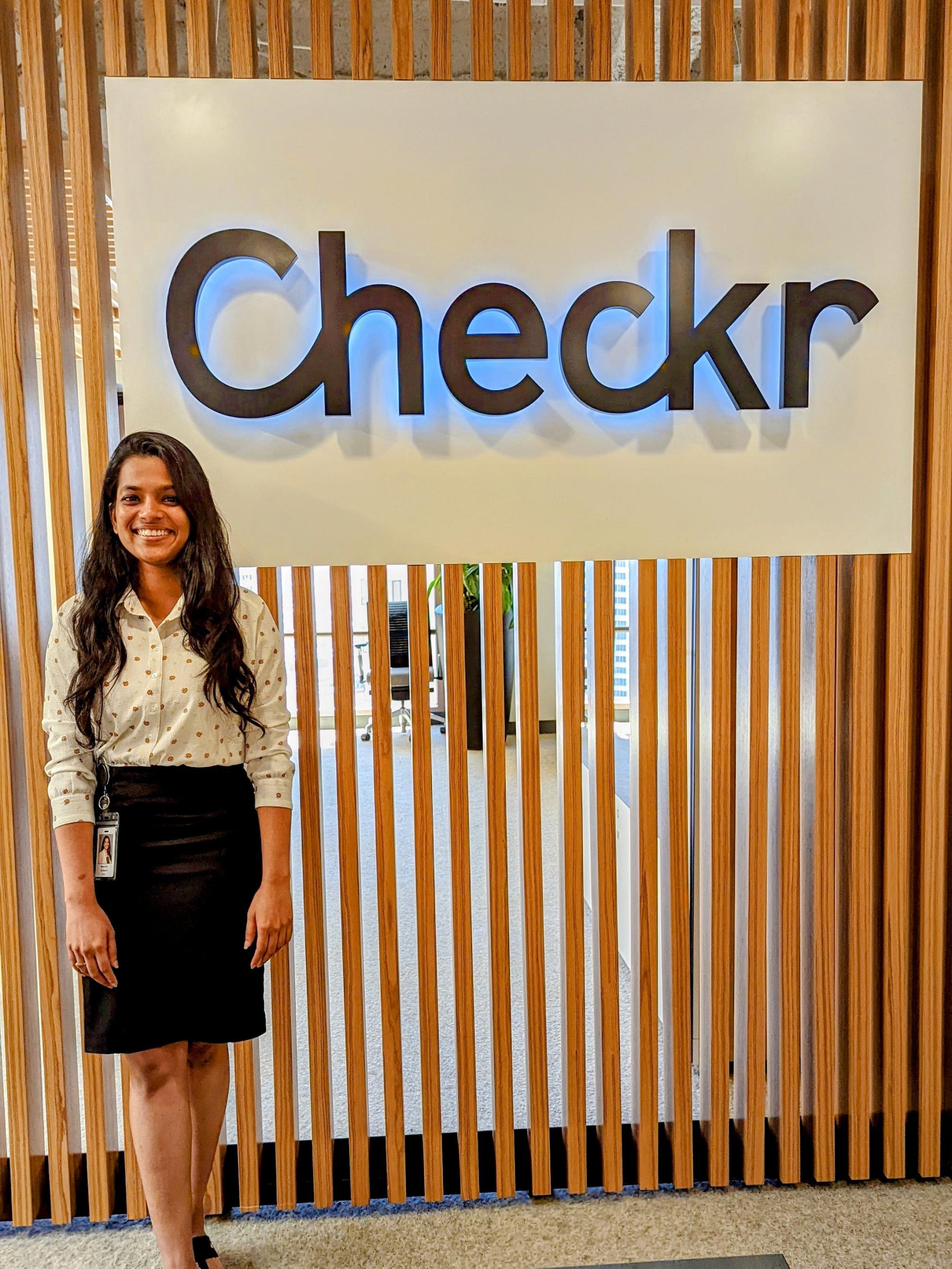 Namratha Sri Mateti in front of a Checkr sign
