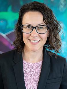 A headshot of Carly Mojica.