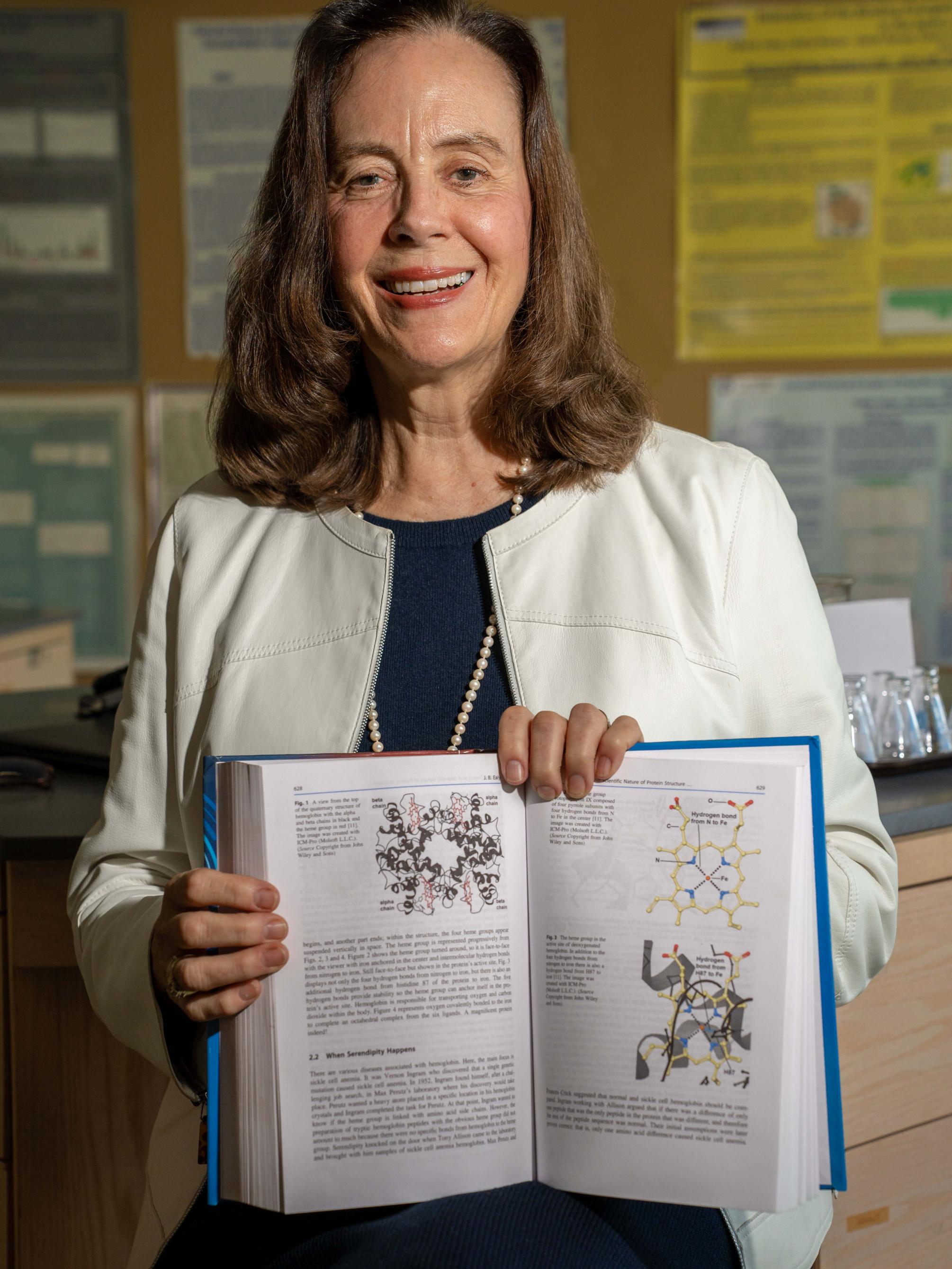 PSU-LV's Dr. Ealy Holding Textbook She Contributed Too