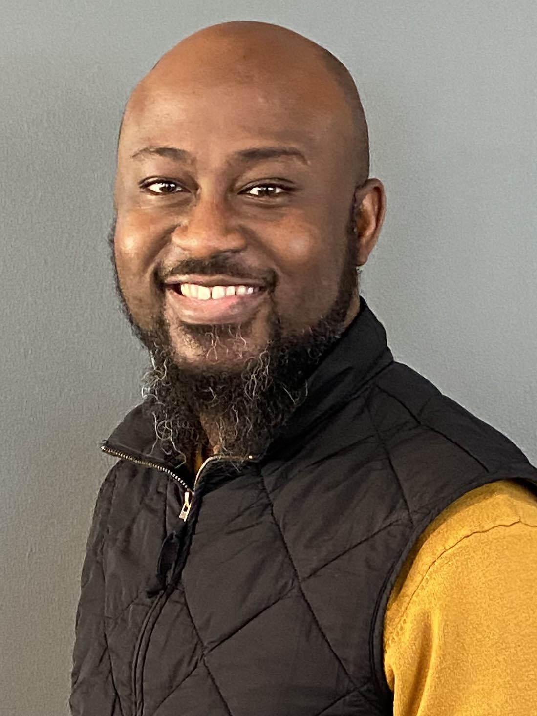 A headshot of Olu Ajisafe