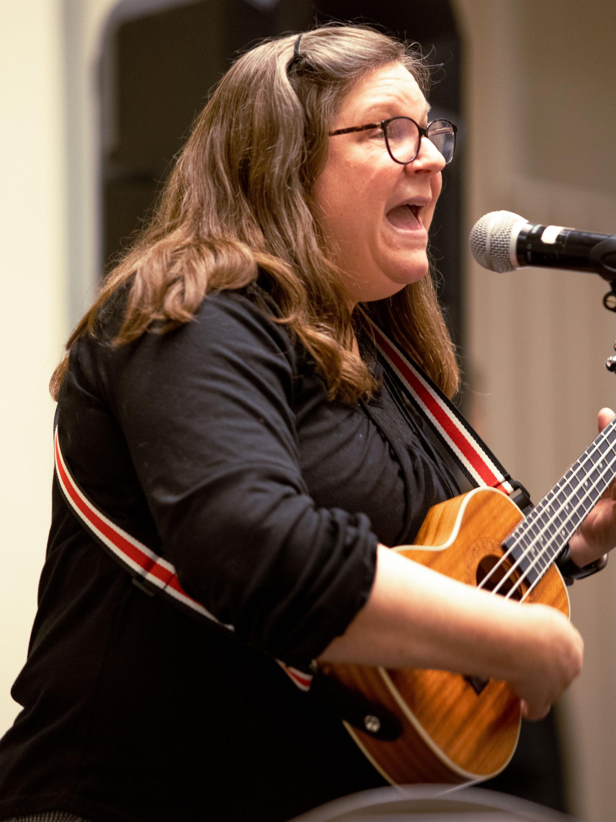 Susan Bogart performs on her ukelele. 