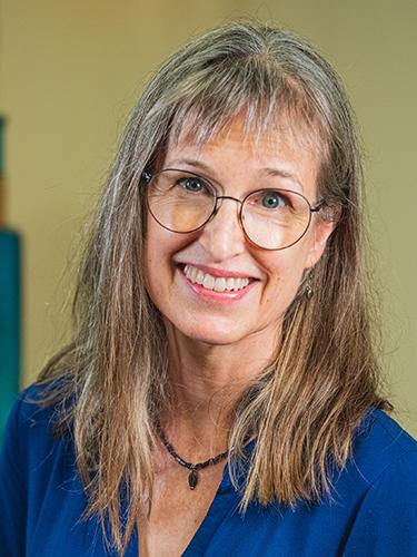 A headshot of Elisa Hopkins.