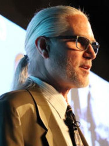 A photo of William Diehl speaking during a presentation.