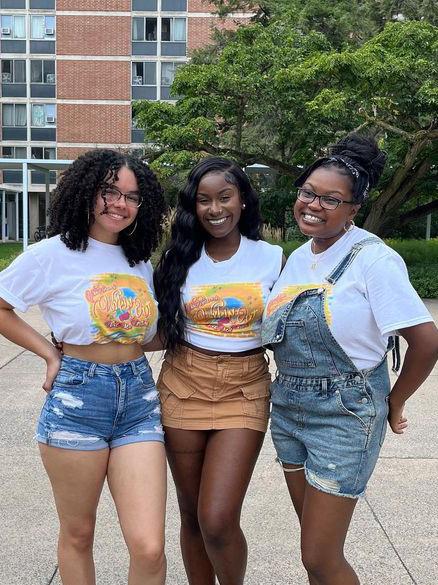 Penn State NAACP Second Vice President Lenneya (left), President Genesis Severino-Ellis (center) and First Vice President Eno Abrefa (right) during the organization’s fall 2022 Block Party.