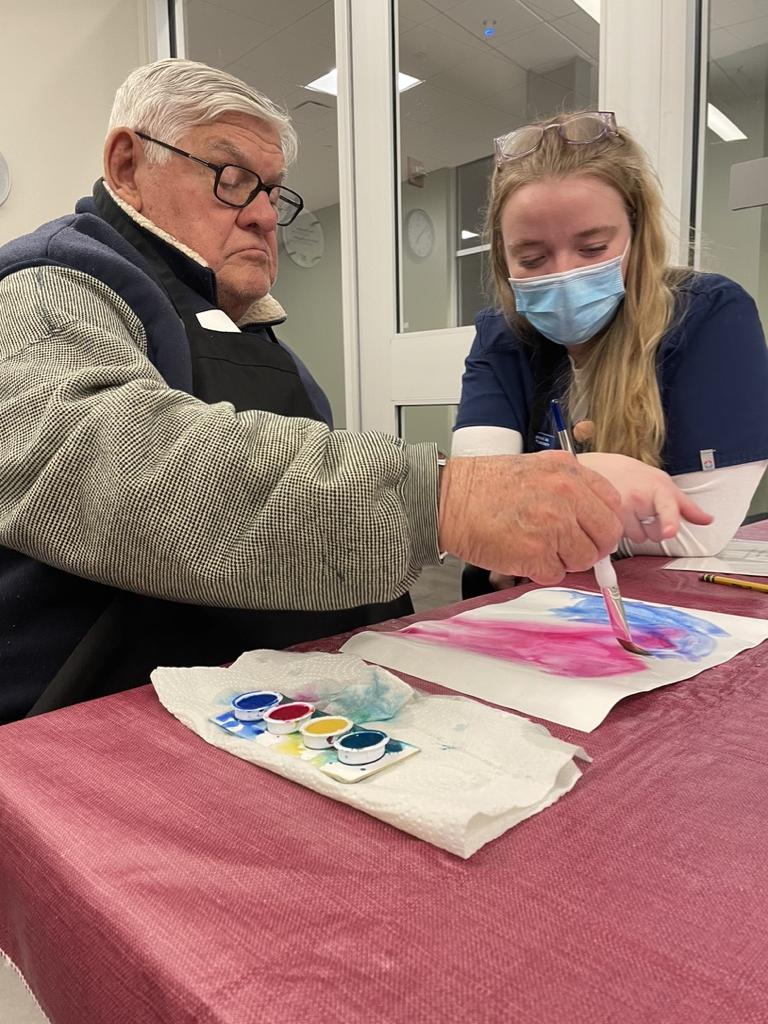 Resident, Gerry, creating art.