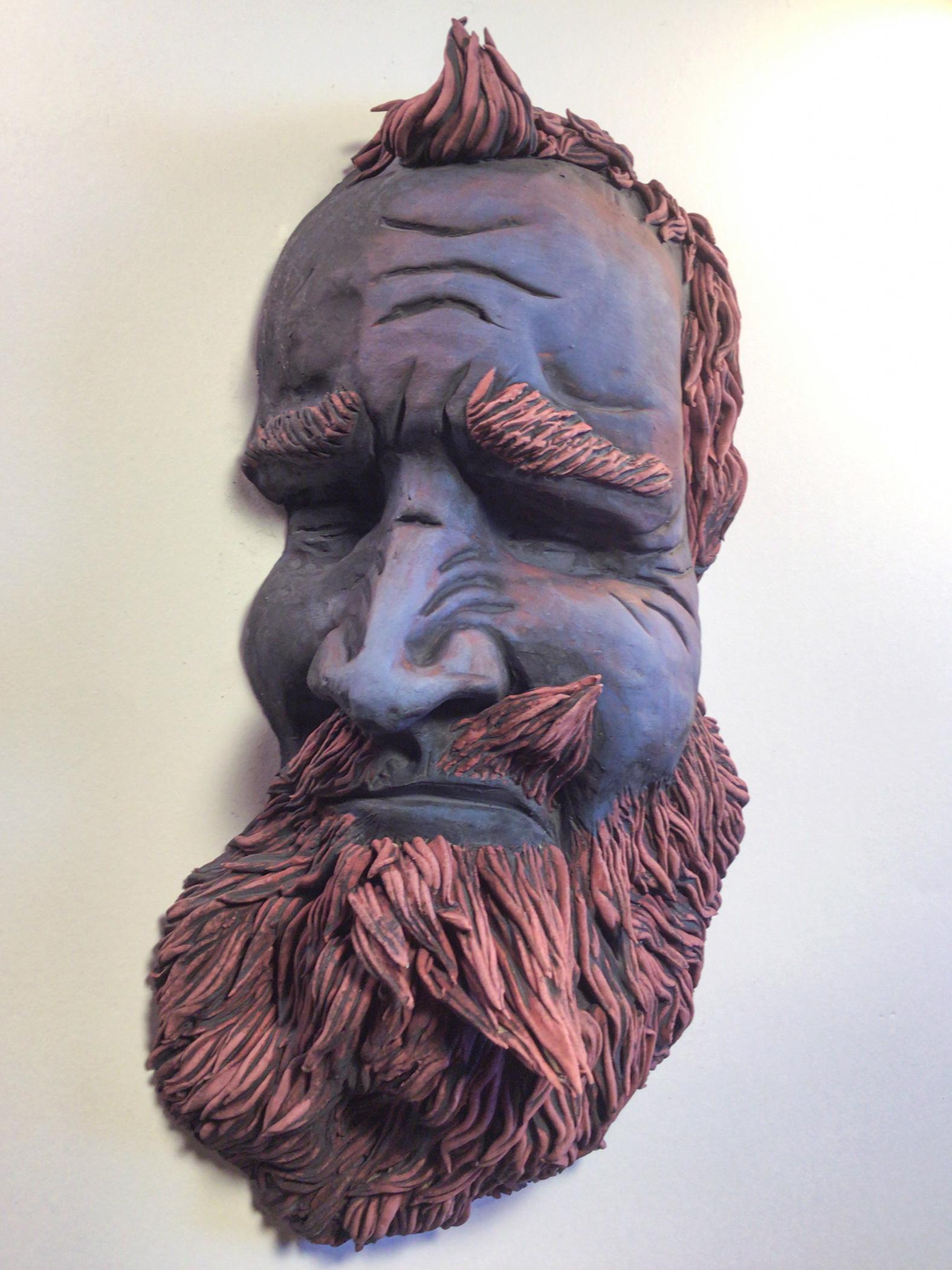 Artwork by Gerald Kaplan, a sculpture of a bearded face in earthenware