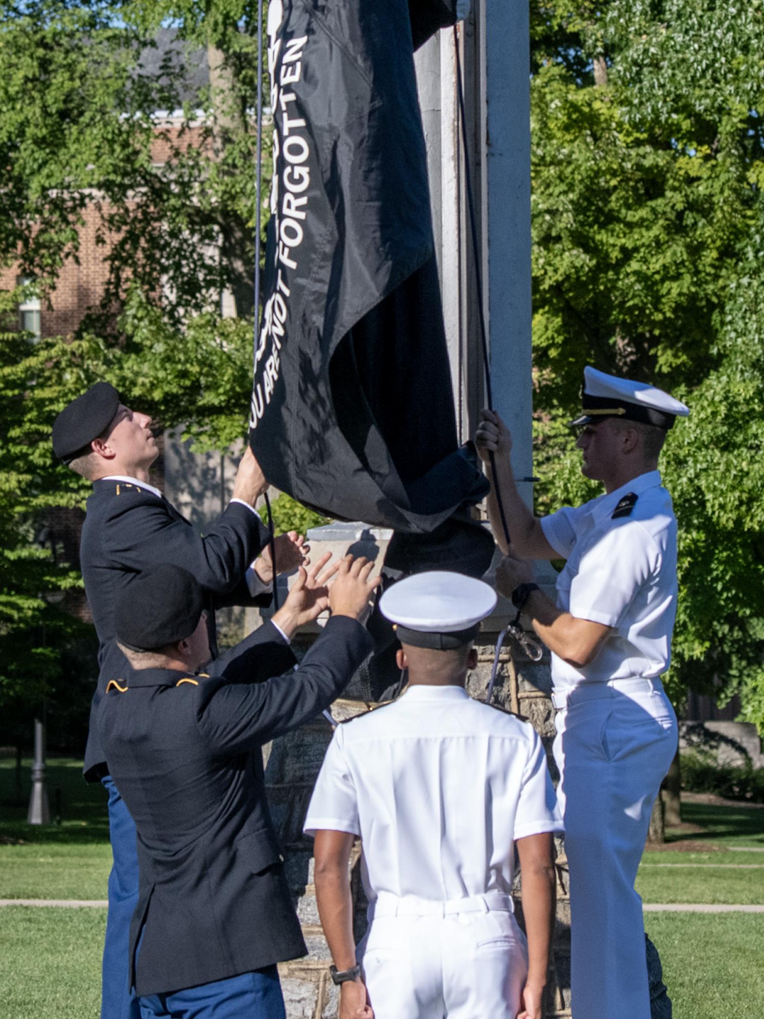 Joint service ROTC raise POW MIA Flag