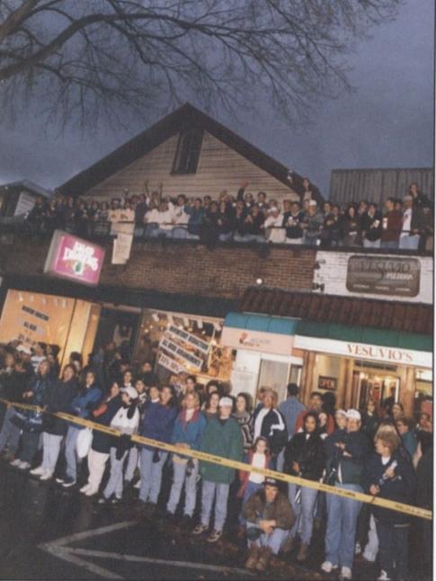 A crowd watches the Homecoming parade in 1996