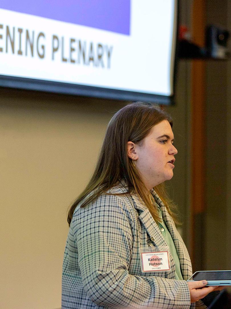 First-year master’s student Katelyn Hutson speaks during the opening plenary session at the crisis simulation.