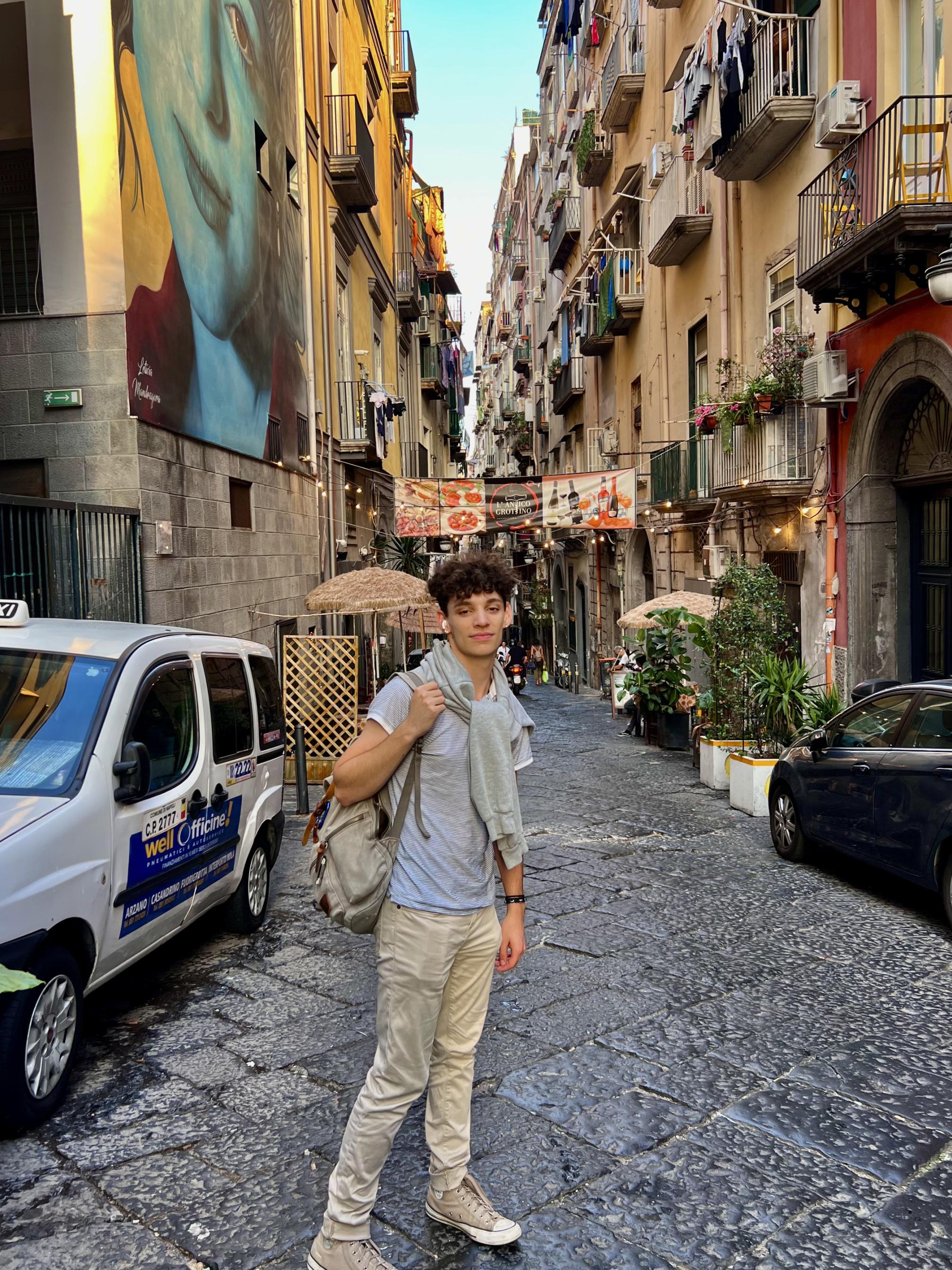 Jimmy Alamia stands on a street in Spain