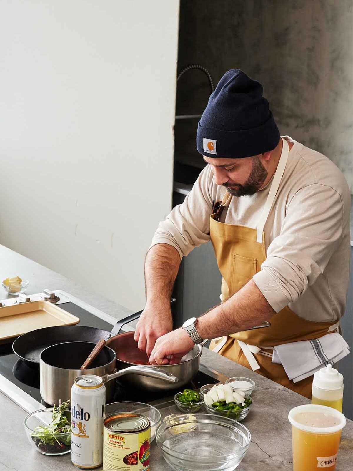 Chef preparing food on a countertop.