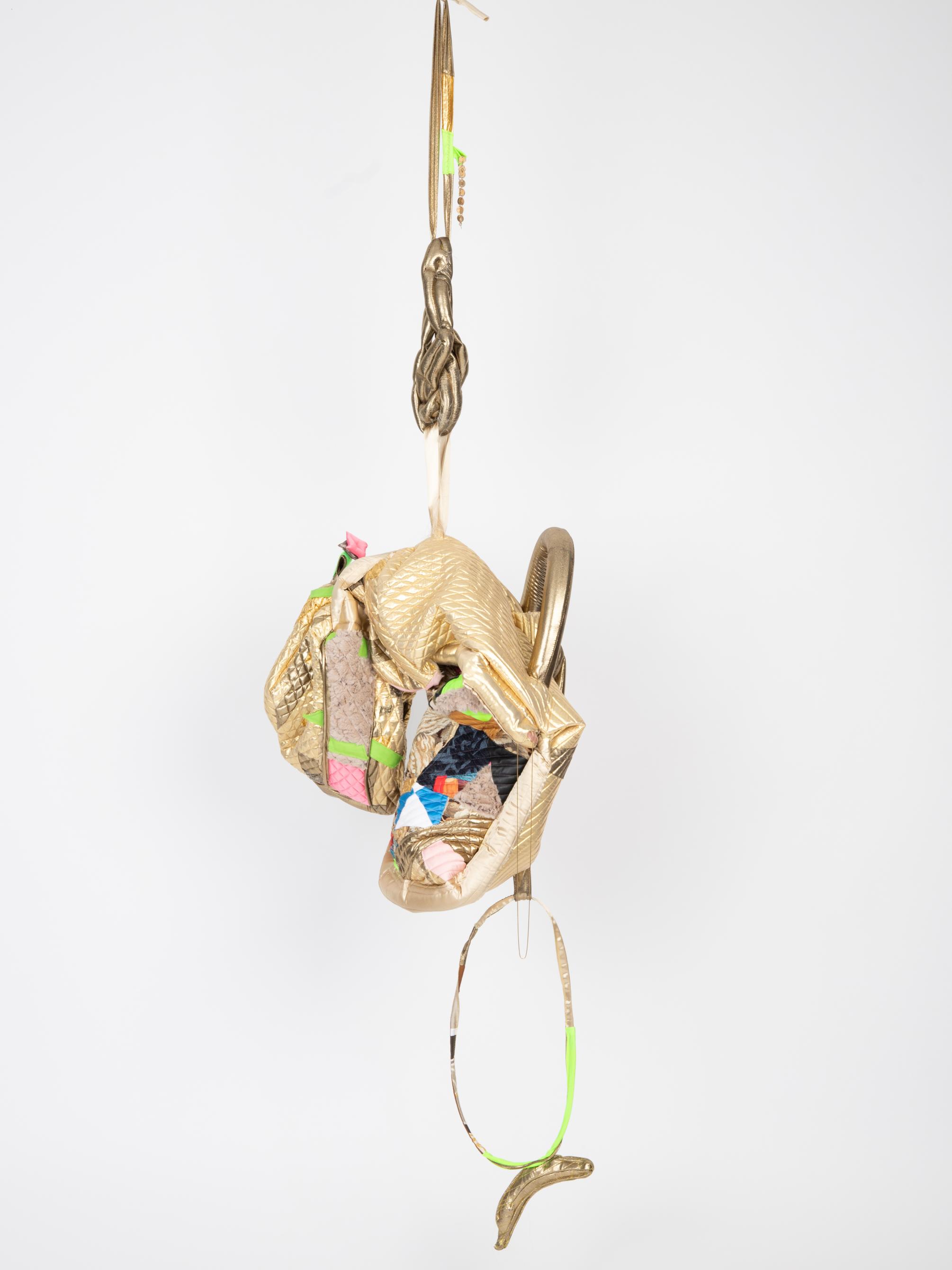 Golden fabric hanging sculpture