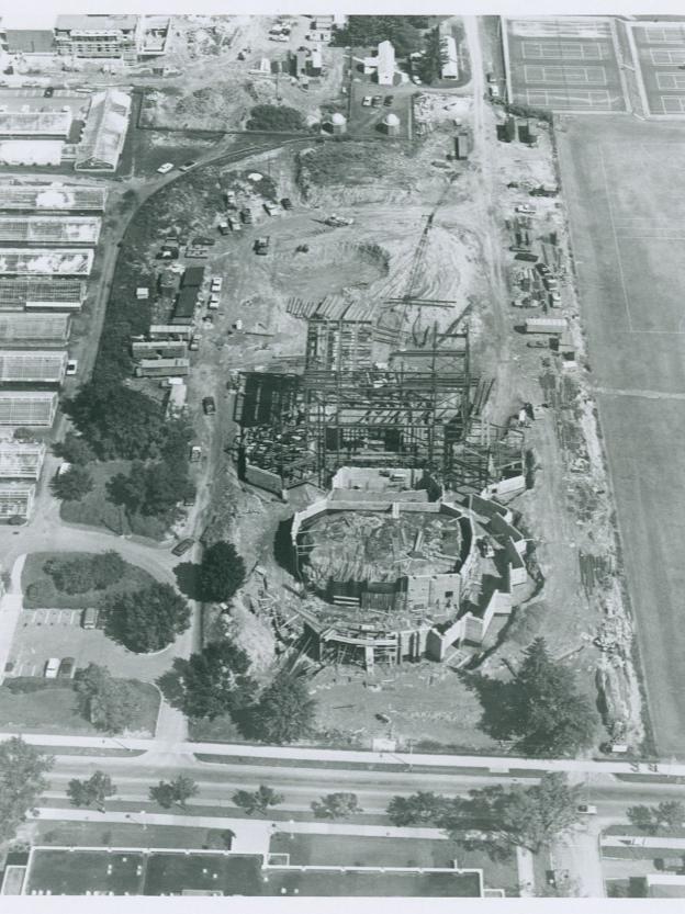 A black and white aerial photograph of a building's construction