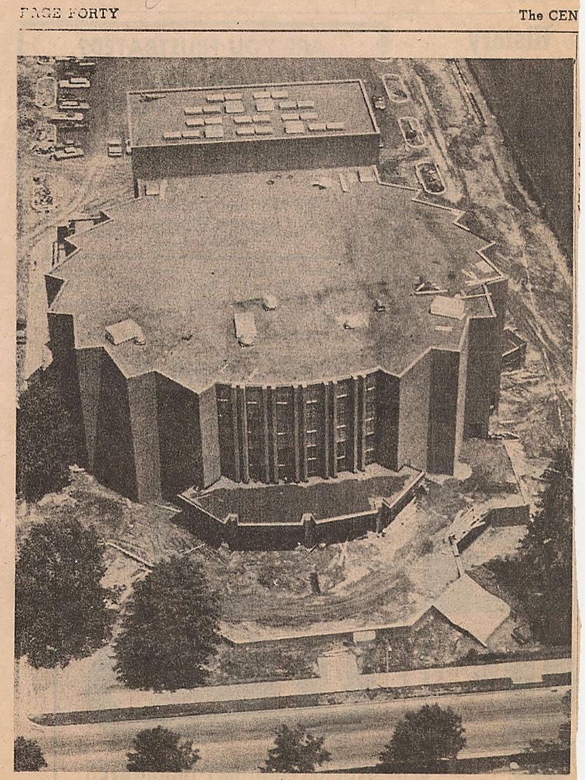An undated newspaper clipping describes the opening of a new auditorium.