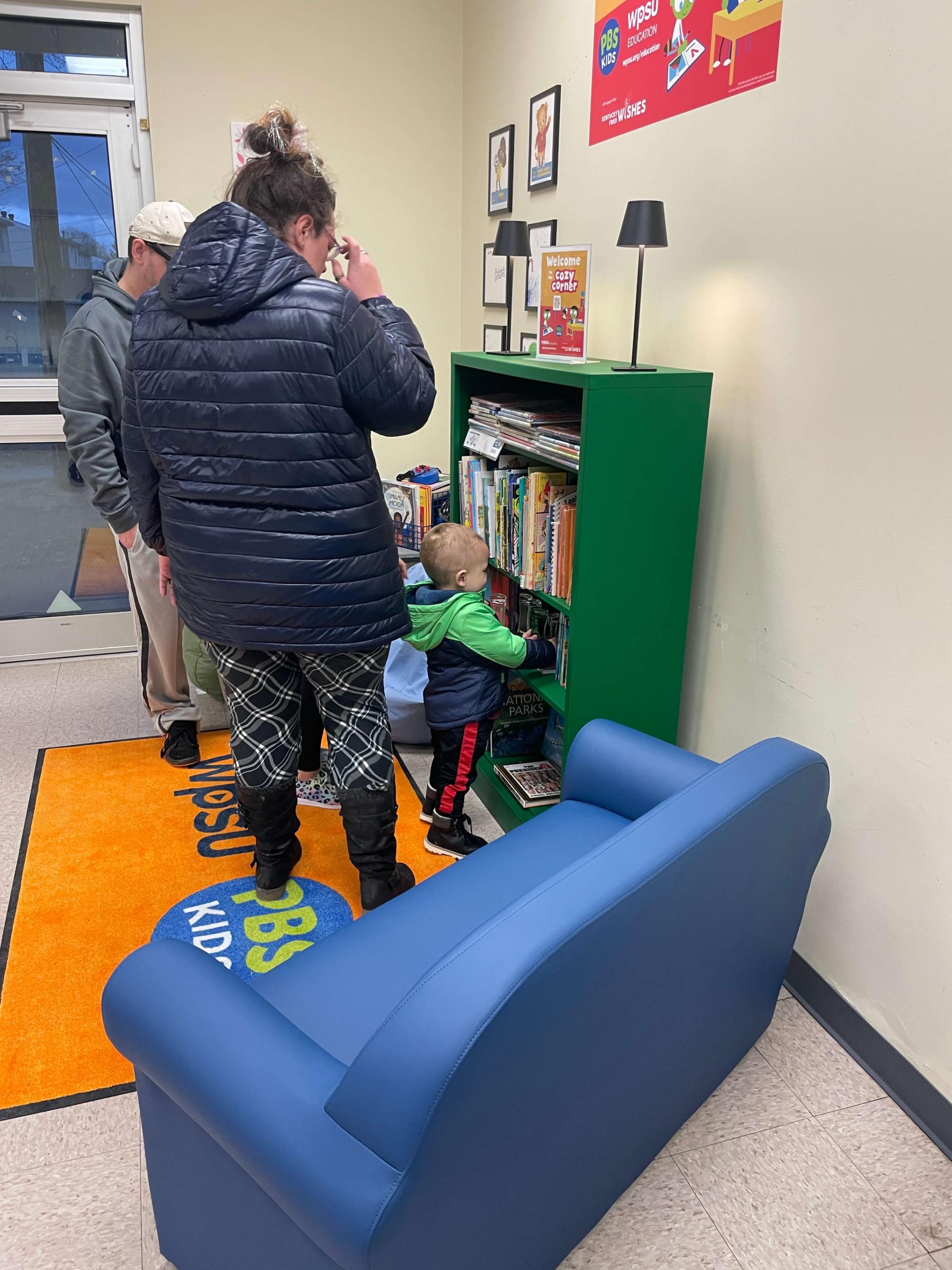 family looking at books