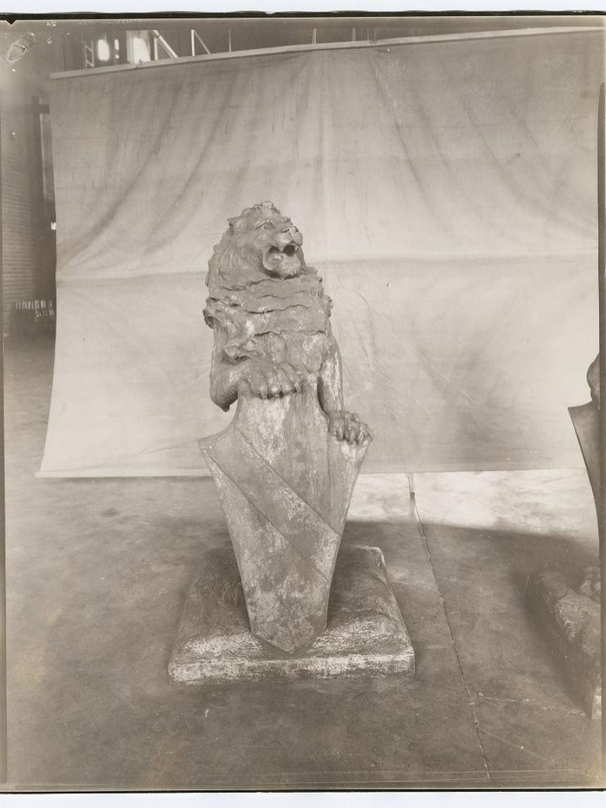 A black and white picture of a lion statue