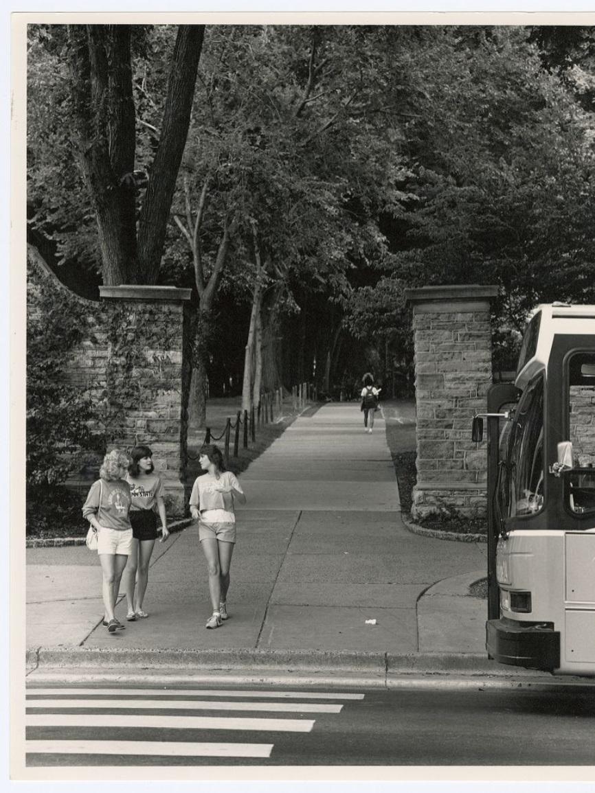 Students about to enter the crosswalk in front of the Memorial Gateway
