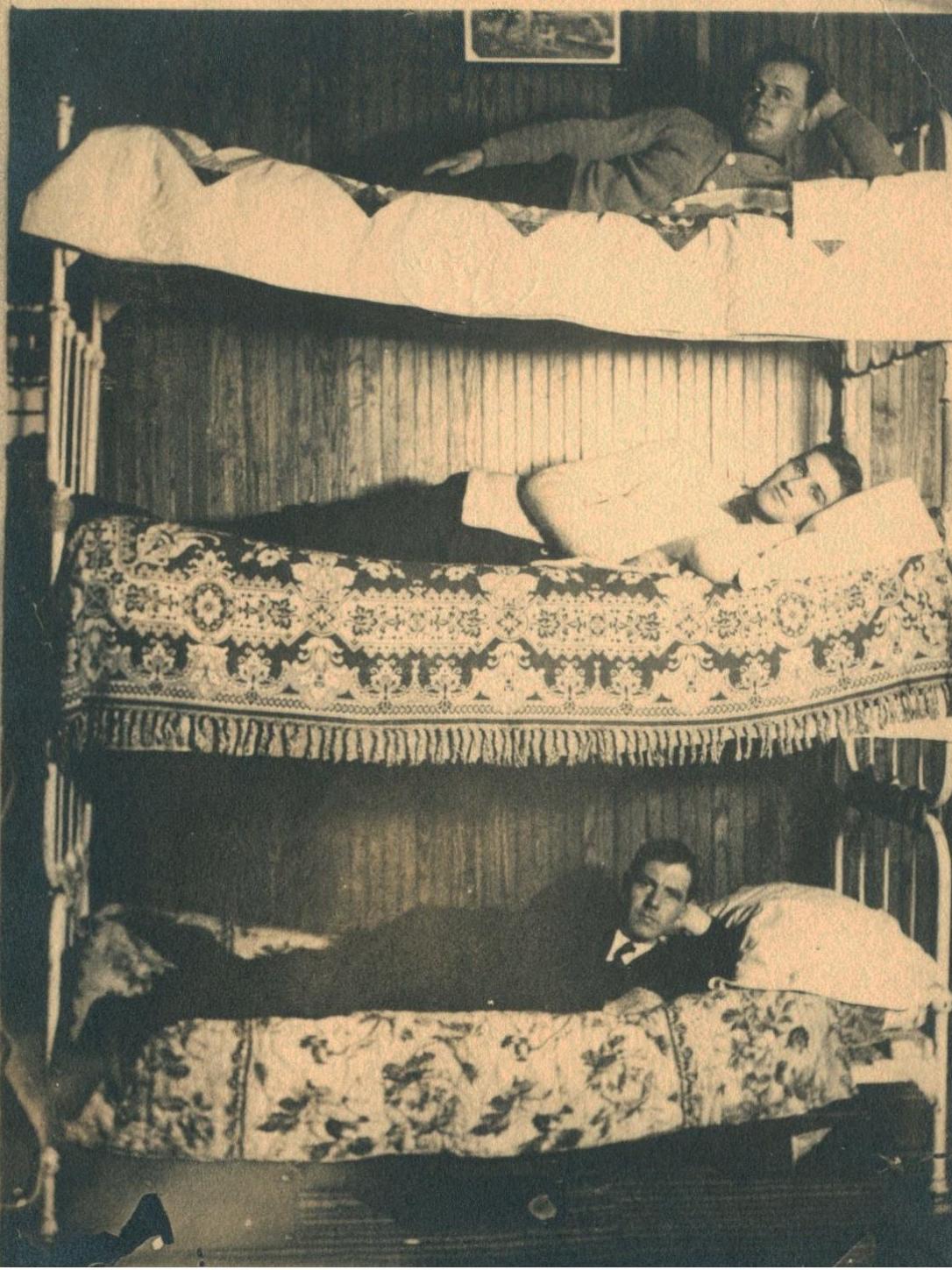 Three bunk beds stacked on top of one another