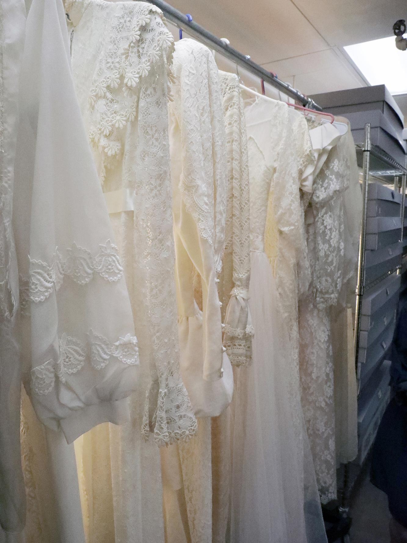 A rack of wedding gowns hanging in the hall